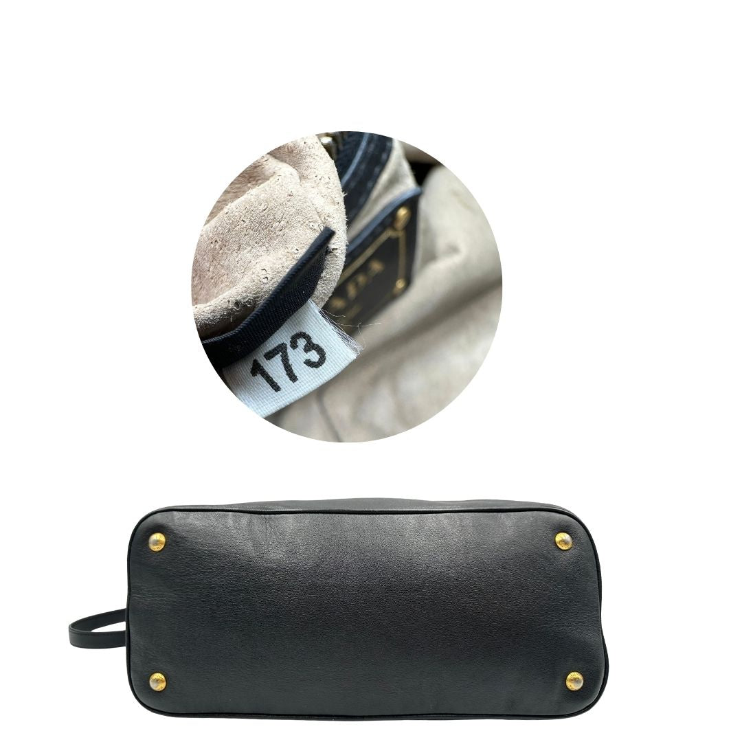 base  Borsa Prada in pelle nera, indossabile a mano e anche a tracolla, di lusso, originale, ottime condizioni, usata. 