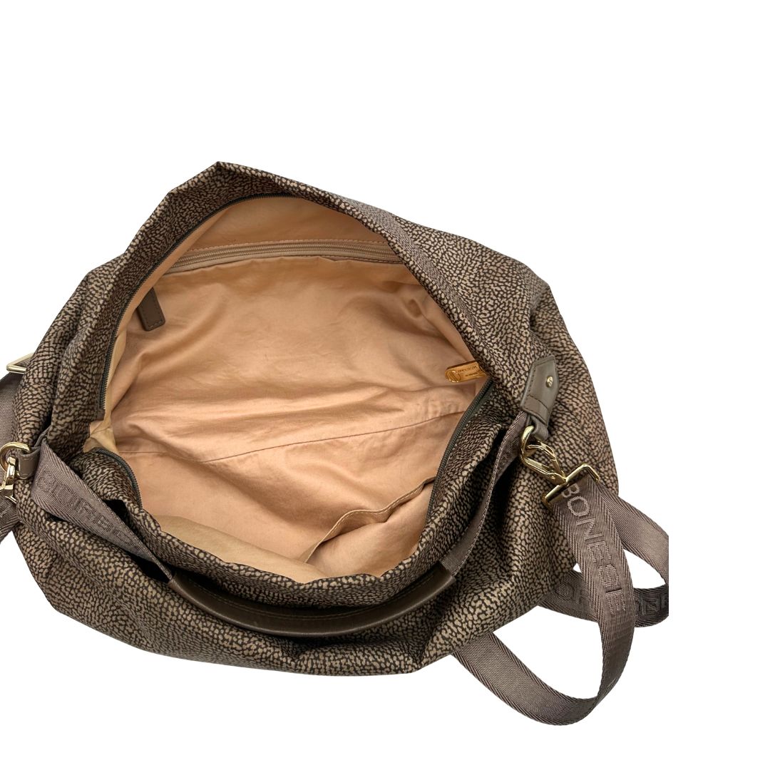 Interno, Borsa Borbonese in tessuto nylon color beige trama occhio di pernice con finiture in pelle bronzo. Indossabile a spalla, a mano, oppure a tracolla. Originale, usata, di lusso, in ottime  condizioni.
