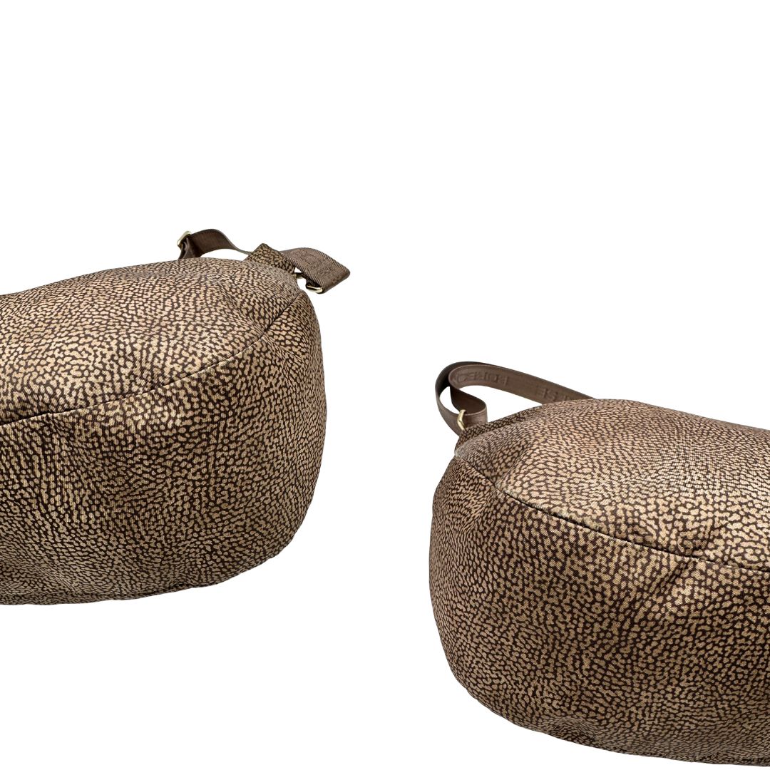 Angoli, Borsa Borbonese in tessuto nylon color beige trama occhio di pernice con finiture in pelle bronzo. Indossabile a spalla, a mano, oppure a tracolla. Originale, usata, di lusso, in ottime  condizioni.