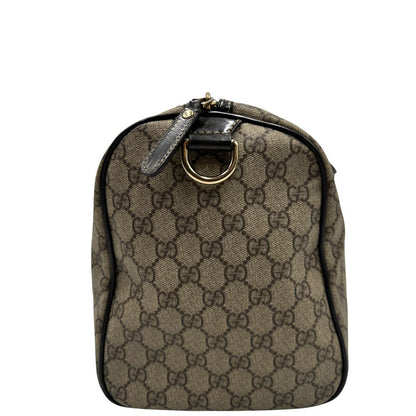 lato Bauletto Gucci GG Boston con finiture in pelle marroni, di lusso, originale, ottime condizioni. 