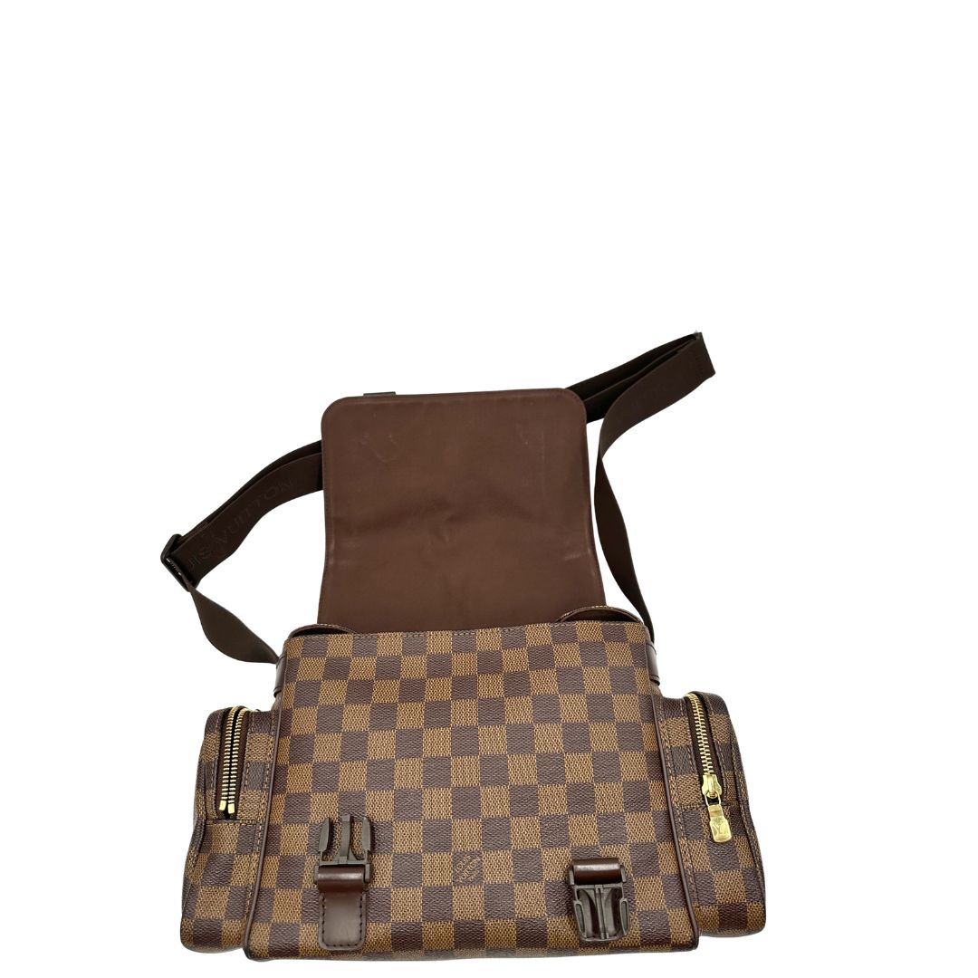 Borsa Louis Vuitton in canvas Damier Ébène con finiture in pelle marrone e dettagli hardware dorati. Design elegante e funzionale, di lusso, originale
