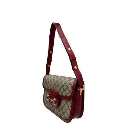 lato  Borsa Gucci in canvas GG e finiture in pelle color amarena con dettaglio Horsebit sulla chiusura, di lusso, originale, ottime condizioni.