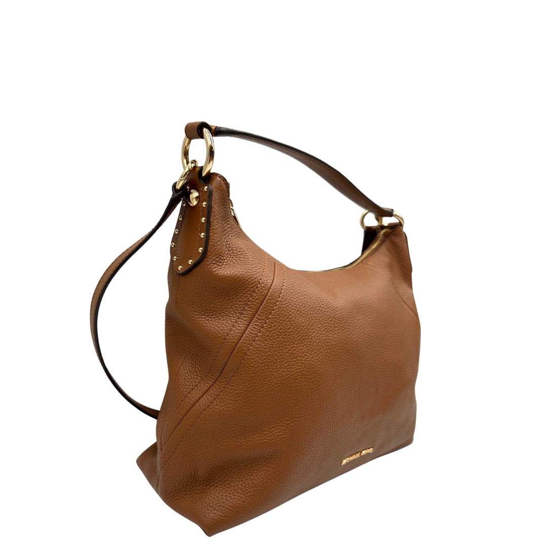 lato Borsa Michael Kors in pelle martellata color cammello e hardware dorato, di lusso, originale, ottime condizioni, usata. 