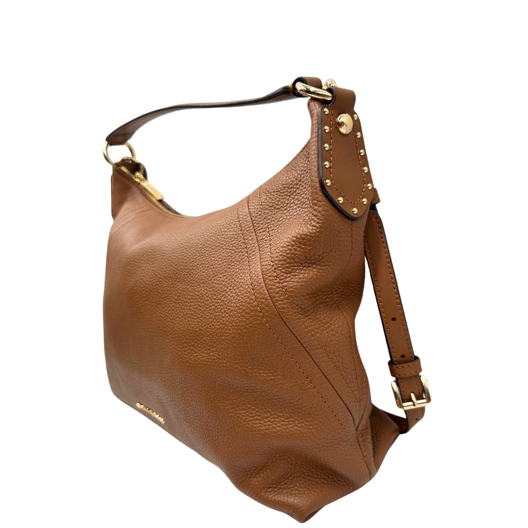 lato Borsa Michael Kors in pelle martellata color cammello e hardware dorato, di lusso, originale, ottime condizioni, usata. 