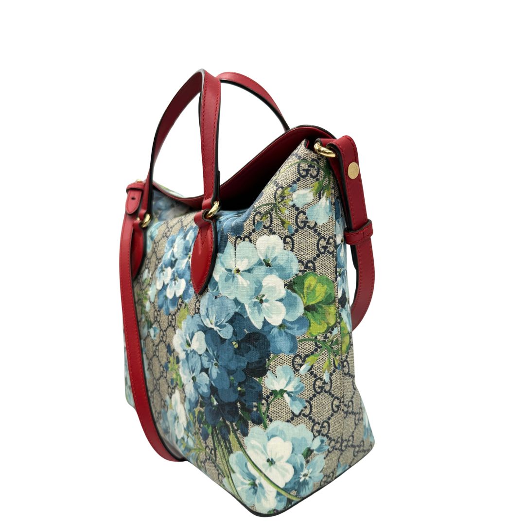 lato Borsa Gucci in canvas GG con trama floreale e finiture in pelle rossa, di lusso, originale, ottime condizioni, usata. 