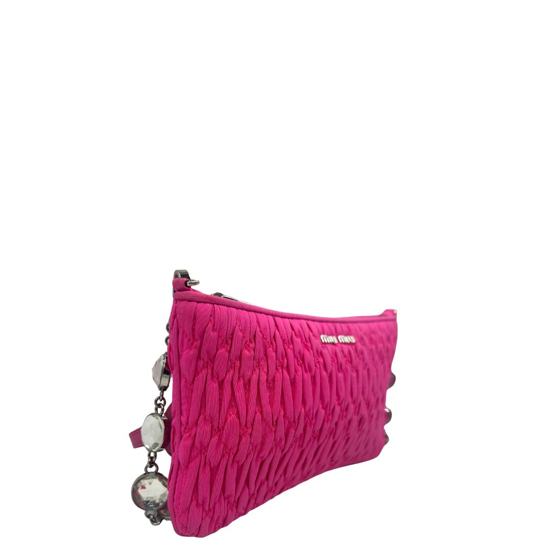 Borsa Miu Miu in faille crystal pink, munita di una tracolla impreziosita da strass, di lusso, originale, ottime condizioni, usata.