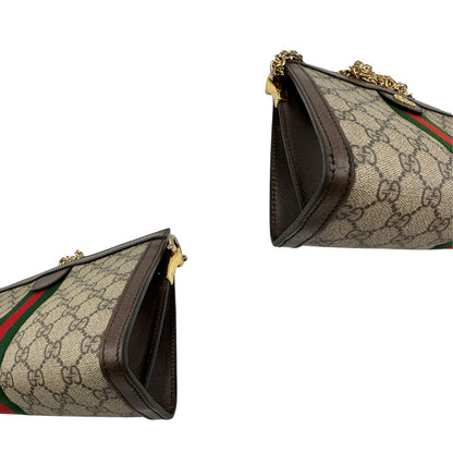 Angoli, Borsa Gucci Ophidia GG beige con finiture in pelle marrone, con iconica striscia Web verde e rossa sul front. Indossabile a tracolla. Originale, usata, di lusso, in ottime condizioni.