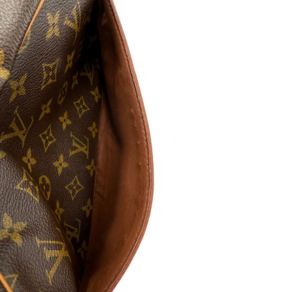 interno Pochette Compiègne Louis Vuitton in canvas marrone monogram con parti metalliche dorate, di lusso, originale, ottime condizioni, usata. 