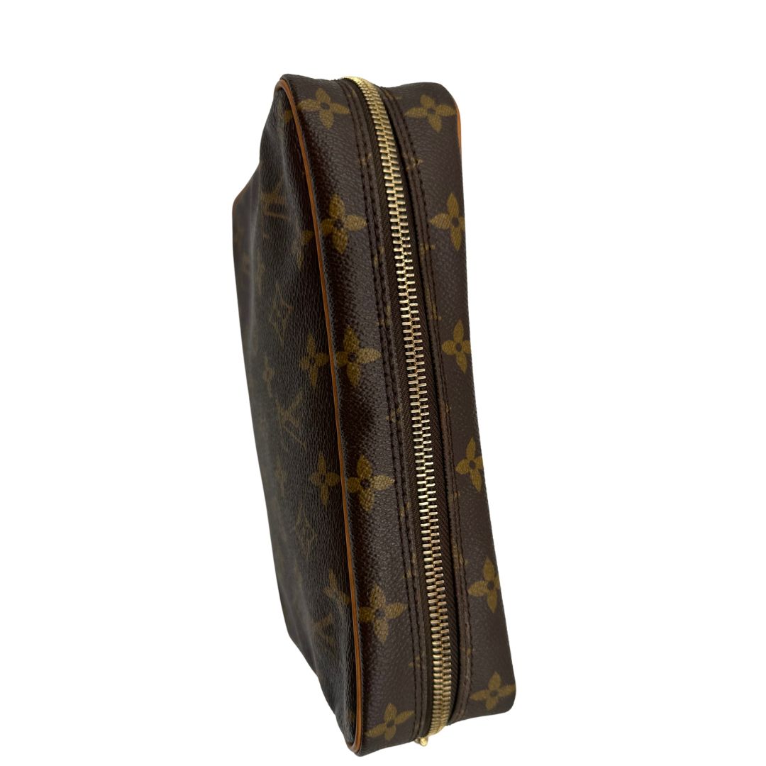 chiusura Pochette Compiègne Louis Vuitton in canvas marrone monogram con parti metalliche dorate, di lusso, originale, ottime condizioni, usata. 