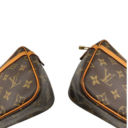 angoli Pochette Compiègne Louis Vuitton in canvas marrone monogram con parti metalliche dorate, di lusso, originale, ottime condizioni, usata. 