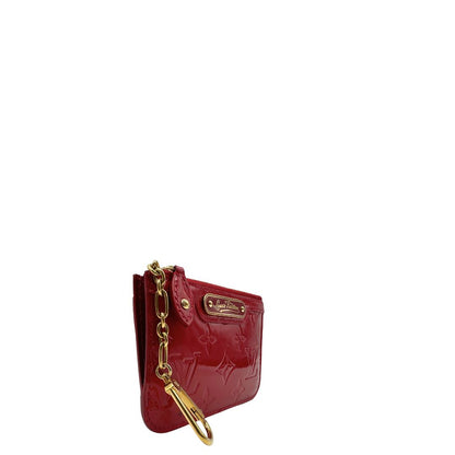Portamonete Louis Vuitton in pelle vernis rossa con trama monogram empreinte e parti metalliche dorate. Originale, usata, di lusso, in ottime condizioni.
