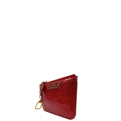 Portamonete Louis Vuitton in pelle vernis rossa con trama monogram empreinte e parti metalliche dorate. Originale, usata, di lusso, in ottime condizioni.