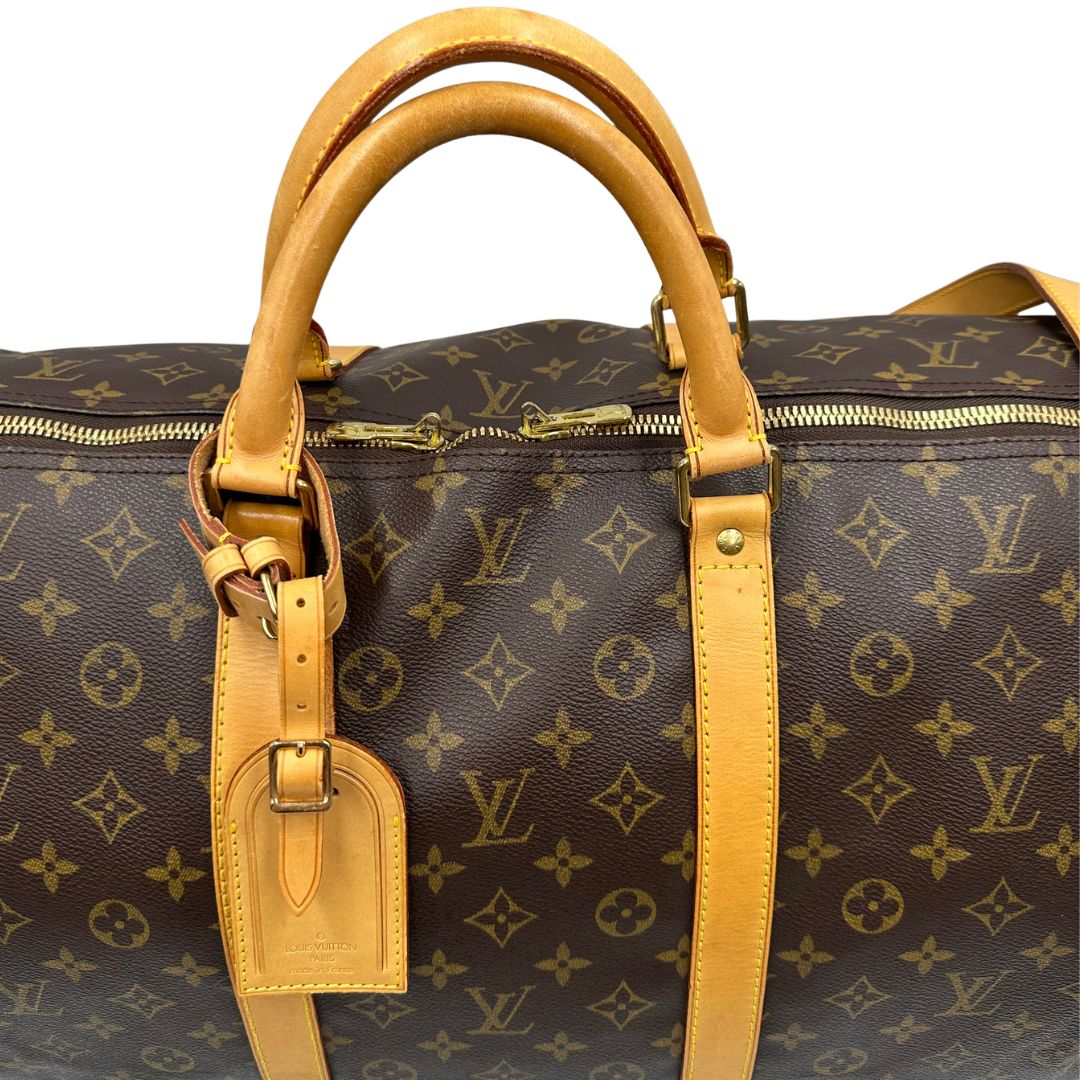 manici  Borsone Louis Vuitton Keepall nella misura 60 in canvas marrone monogram e finiture in vacchetta naturale, di lusso, originale, ottime condizioni, usato. 
