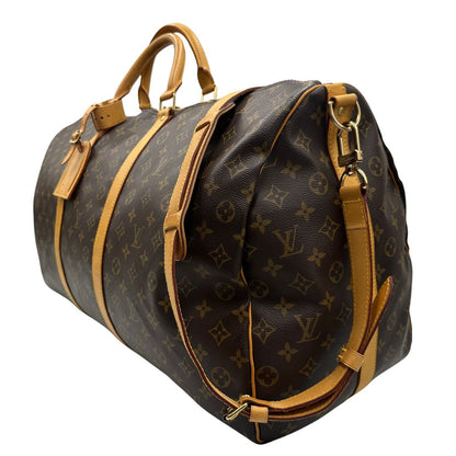 lato  Borsone Louis Vuitton Keepall nella misura 60 in canvas marrone monogram e finiture in vacchetta naturale, di lusso, originale, ottime condizioni, usato. 