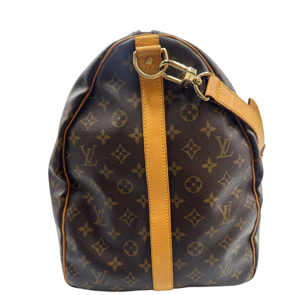 lato  Borsone Louis Vuitton Keepall nella misura 60 in canvas marrone monogram e finiture in vacchetta naturale, di lusso, originale, ottime condizioni, usato. 