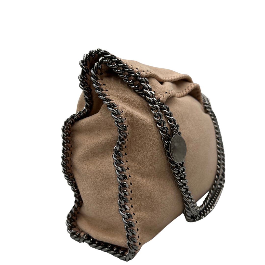 lato  Borsa Falabella nella versione fold over tote color rosa cipria, di lusso, originale, ottime condizioni, usata 