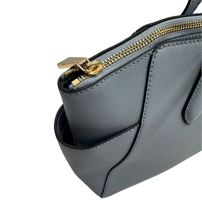  Borsa MK in pelle saffiano celeste, munita di doppi manici, indossabile a spalla, di lusso, originale, ottime condizioni.