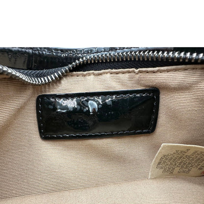 Borsa Burberry in canvas trama tartan e finiture in pelle vernis nera, puoi portarla a spalla oppure a mano. Originale, usata, di lusso, in ottime condizioni.