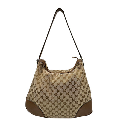 Front, Borsa Gucci GG in tessuto e pelle marrone; munita di un manico singolo, indossabile a spalla. Originale, usata, di lusso, in buone condizioni.