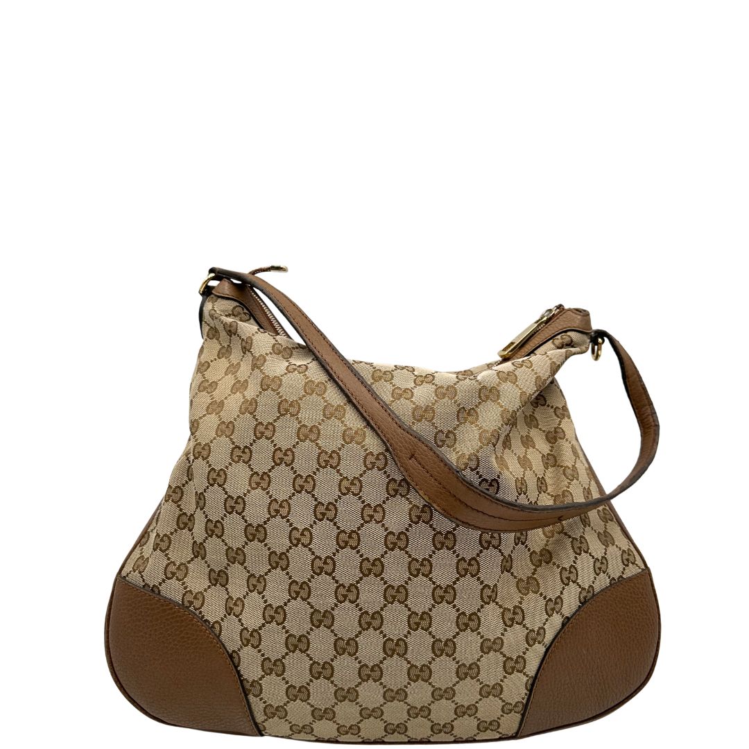 Retro, Borsa Gucci GG in tessuto e pelle marrone; munita di un manico singolo, indossabile a spalla. Originale, usata, di lusso, in buone condizioni.