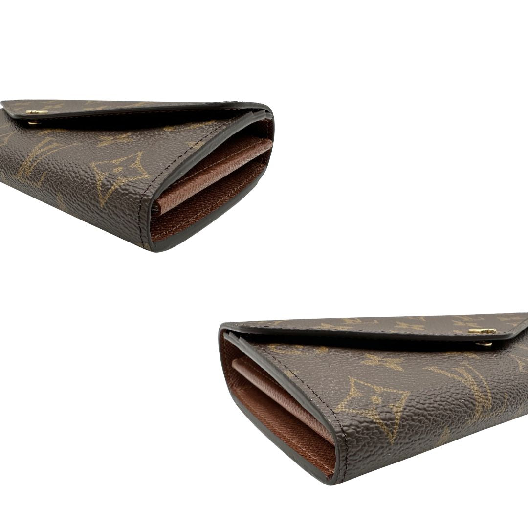 Angoli, Portafoglio Louis Vuitton Sarah in canvas monogrammato marrone, con parti metalliche dorate. Originale, usato, di lusso, in condizioni eccellenti.