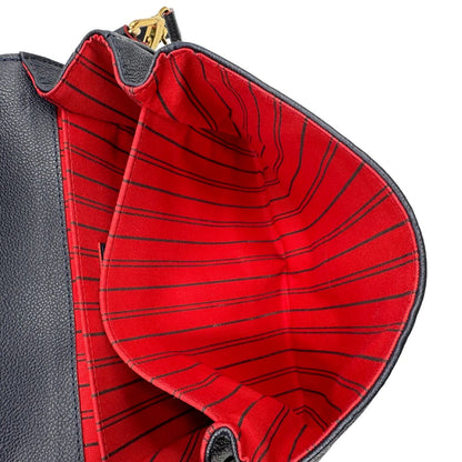 Interno, Borsa Louis Vuitton Métis in pelle monogram empreinte blu notte con parti metalliche dorate. Munita di un manico e tracolla regolabile con fibbia e amovibile. Originale, usata, di lusso, in ottime condizioni.