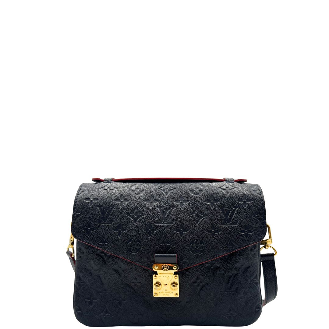 Front, Borsa Louis Vuitton Métis in pelle monogram empreinte blu notte con parti metalliche dorate. Munita di un manico e tracolla regolabile con fibbia e amovibile. Originale, usata, di lusso, in ottime condizioni.