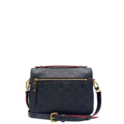 Retro, Borsa Louis Vuitton Métis in pelle monogram empreinte blu notte con parti metalliche dorate. Munita di un manico e tracolla regolabile con fibbia e amovibile. Originale, usata, di lusso, in ottime condizioni.