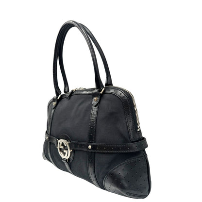 lato  Borsa Gucci in tessuto nero con finiture in pelle traforata, indossabile a spalla, di lusso, originale, ottime condizioni 