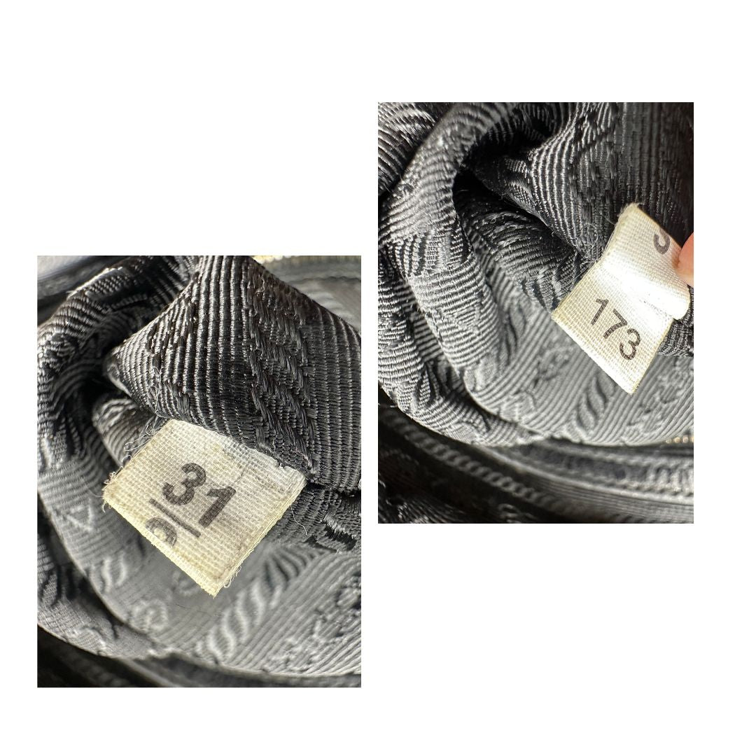 Borsa Prada in pelle nera effetto invecchiato, dotata di doppi manici e tracolla regolabile e amovibile con dettagli in metallo dorato, design capiente e versatile. Originale, usato, di lusso, in ottime condizioni.