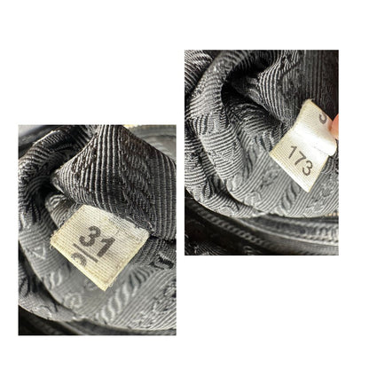 Borsa Prada in pelle nera effetto invecchiato, dotata di doppi manici e tracolla regolabile e amovibile con dettagli in metallo dorato, design capiente e versatile. Originale, usato, di lusso, in ottime condizioni.