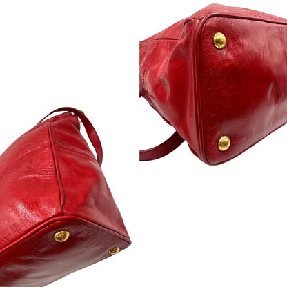 angoli Borsa Prada in pelle rossa munita di doppi manici stondati e una tracolla amovibile e regolabile, di lusso, originale, ottime condizioni, usata 
