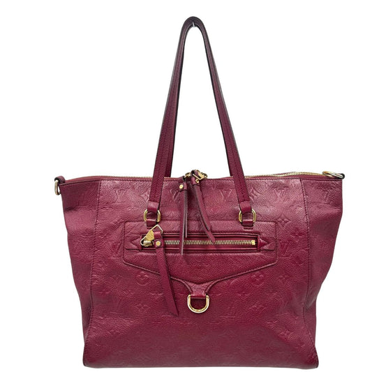 Front, Louis Vuitton in pelle monogram empreinte color magenta con hardware dorato , munita di doppi manici. Indossabile a spalla. Originale, usata, di lusso, in ottime condizioni.