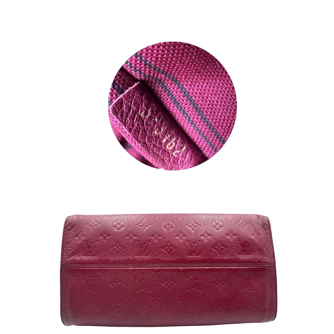 Base, Louis Vuitton in pelle monogram empreinte color magenta con hardware dorato , munita di doppi manici. Indossabile a spalla. Originale, usata, di lusso, in ottime condizioni.