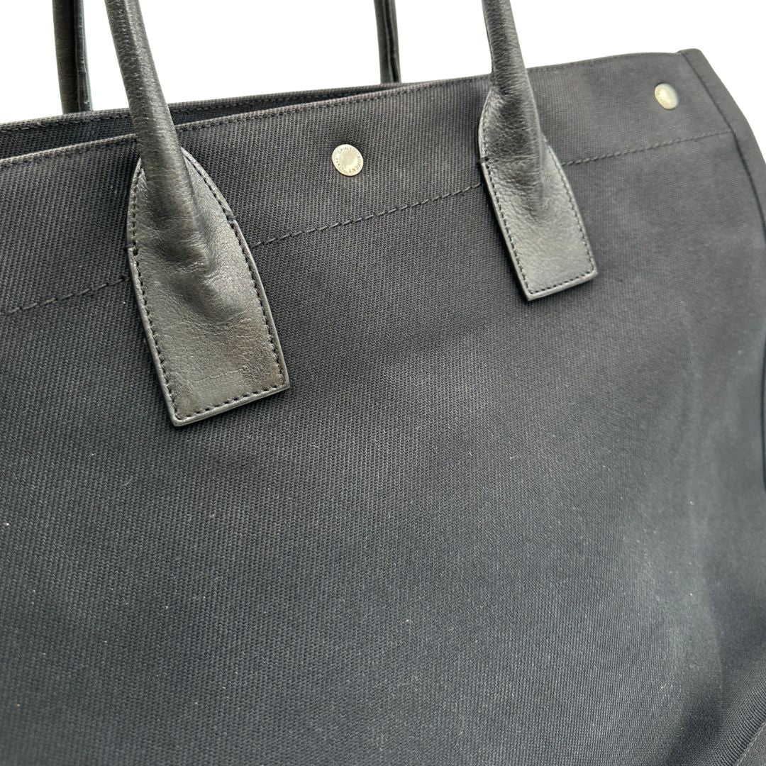 Borsa tote Saint Laurent Rive Gauche realizzata in tessuto nero con manici in pelle tono su tono, di lusso, originale , ottime condizioni, usata