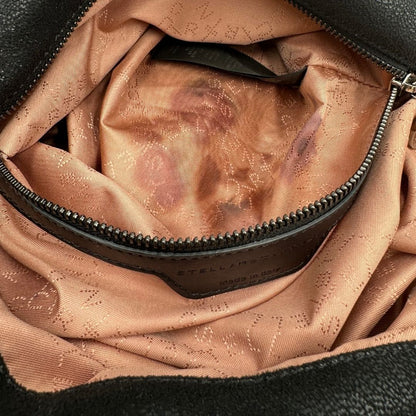 interno  Borsa Falabella nella versione fold over tote nera, con hardware dorato e argentato, di lusso, originale, ottime condizioni, usata 