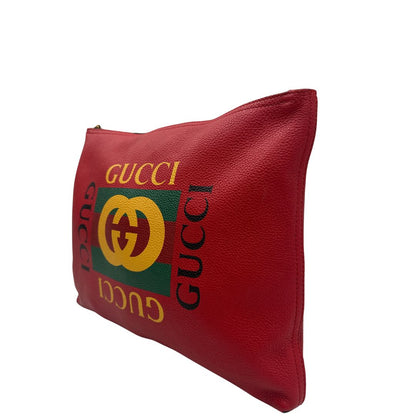 lato  Pochette Gucci in pelle rossa logata sul front, di lusso, originale, ottime condizioni, usata 