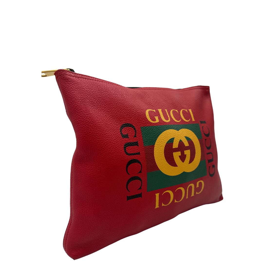 lato  Pochette Gucci in pelle rossa logata sul front, di lusso, originale, ottime condizioni, usata 