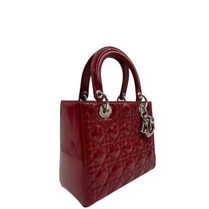 lato  Borsa Lady Dior realizzata in pelle rossa vernis , di lusso, originale, ottime condizioni, usata 
