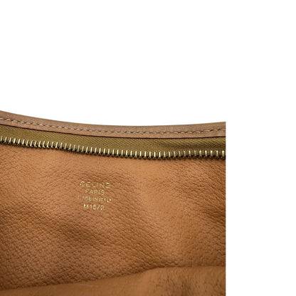 Interno, Pratica pochete Celine in canvas marrone con finiture in vacchetta.