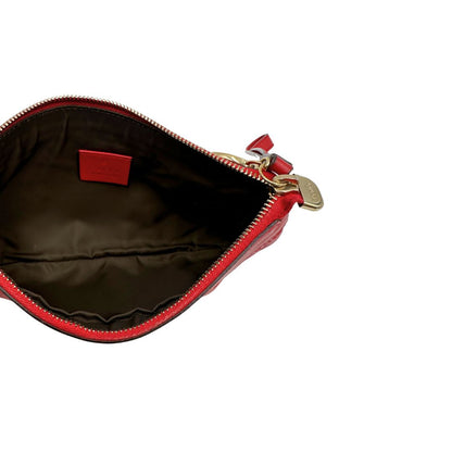 Interno,  Pochette Gucci in pelle rossa con trama Guccissima, da poratre a mano. Originale, usata, di lusso, in ottime condizioni.