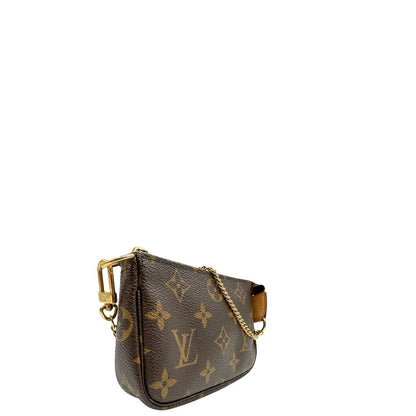 lato Pochette Accessoires mini in canvas marrone monogram, da portare a mano.