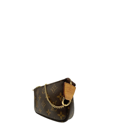 lato Pochette Accessoires mini in canvas marrone monogram, da portare a mano.