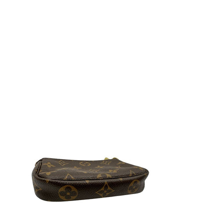 base Pochette Accessoires mini in canvas marrone monogram, da portare a mano.