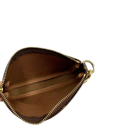 interno Pochette Accessoires mini in canvas marrone monogram, da portare a mano. 