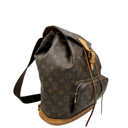lato Zaino Montsouris GM in canvas marrone monogram con finiture in vacchetta naturale e parti metalliche dorate, munito di due bretelle in tessuto e vacchetta, regolabili con fibbie, di lusso, originale, ottime condizioni, usato 