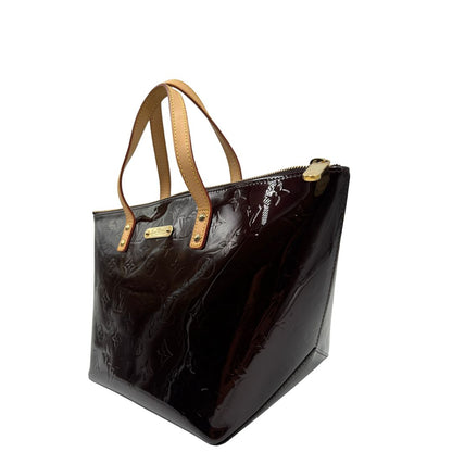 lato  Borsa Louis Vuitton in pelle vernis bordeaux monogram e hardware dorato, di lusso, originale, ottime condizioni, usata. 