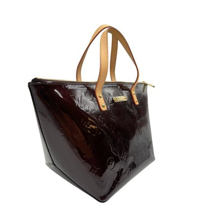 lato  Borsa Louis Vuitton in pelle vernis bordeaux monogram e hardware dorato, di lusso, originale, ottime condizioni, usata. 