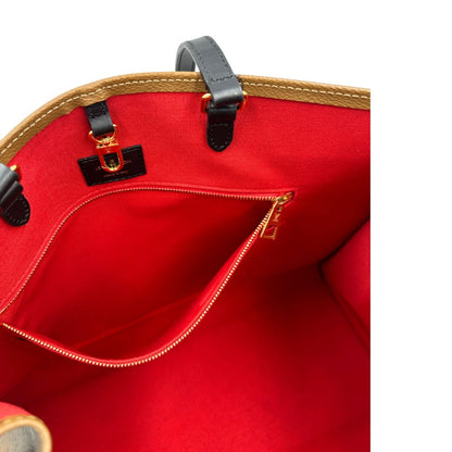 Interno tasca, Borsa LV OnTheGo nella versione GM in canvas marrone monogram Giant e monogram Reverse. Originale, usata, di lusso, in ottime condizioni.
