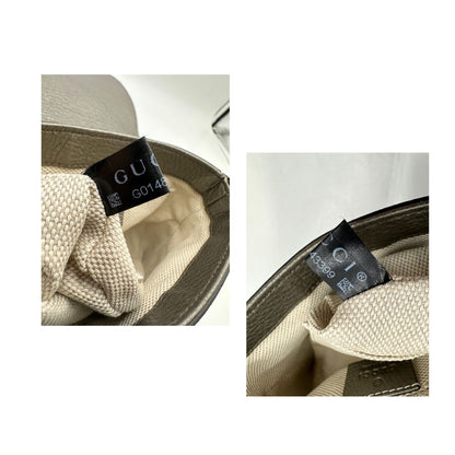 Borsa Gucci Soho in pelle martellata grigia dall’effetto leggermente metallizzato, con tracolla a catena e nappa decorativa con frange. Originale, usata, di lusso, in ottime condizioni.